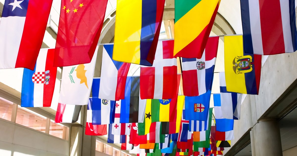 Flags of the world displayed at a convention center