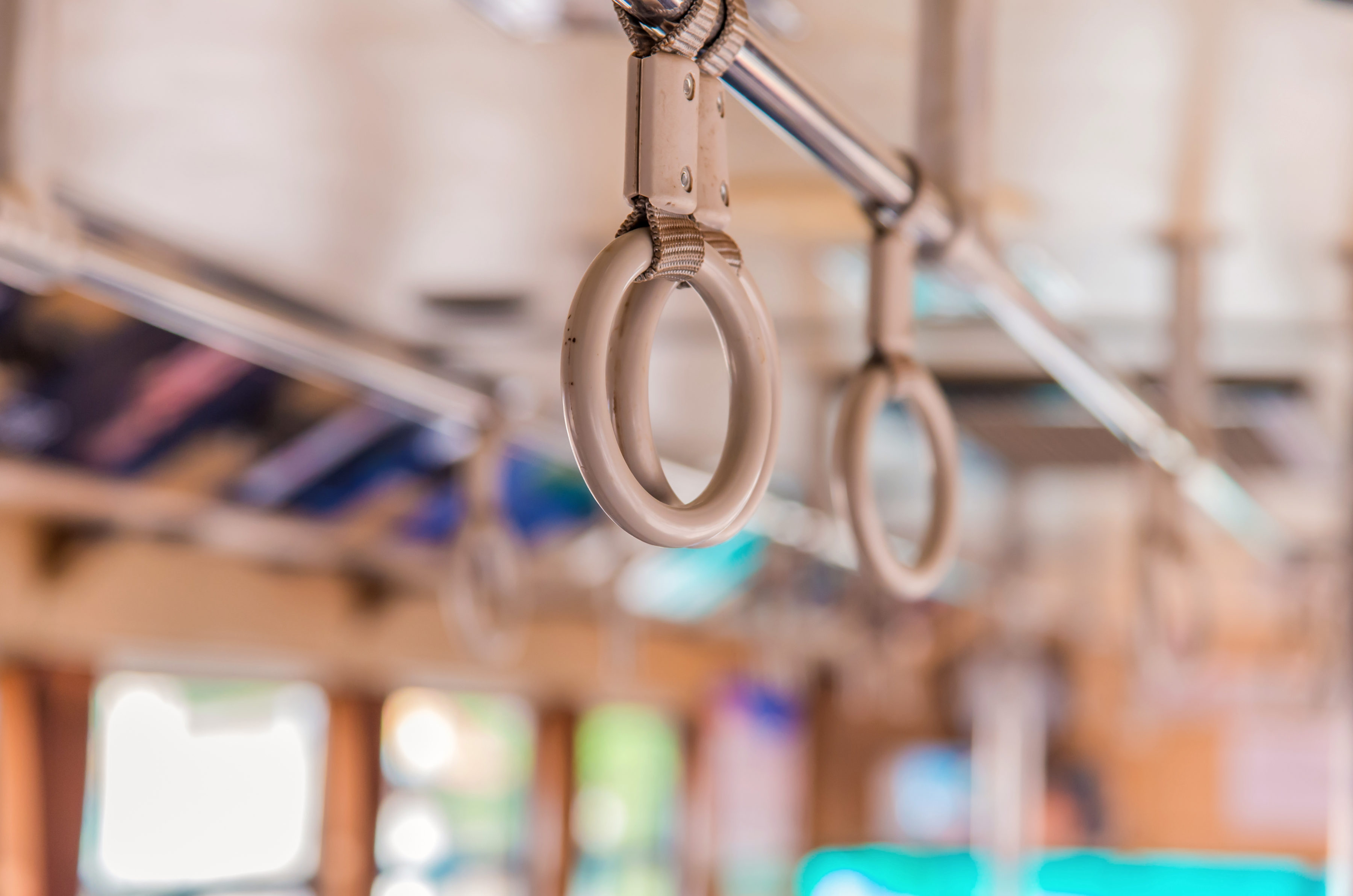 Handles on ceiling for standing passenger inside a bus
