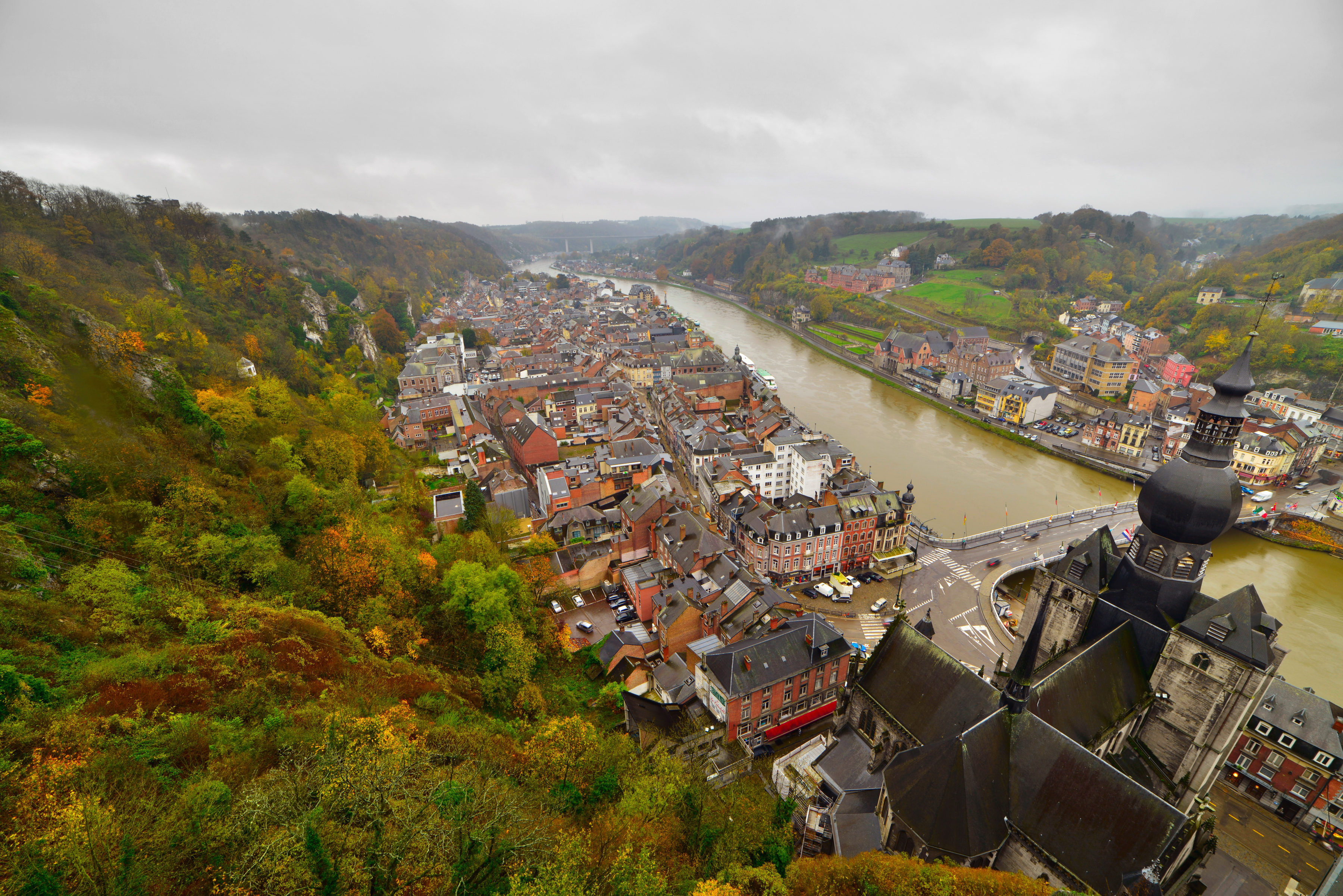 Top view of the city of Dinant with church on a cloudy day. Seen from the fortress. Belgium. Ardennes.