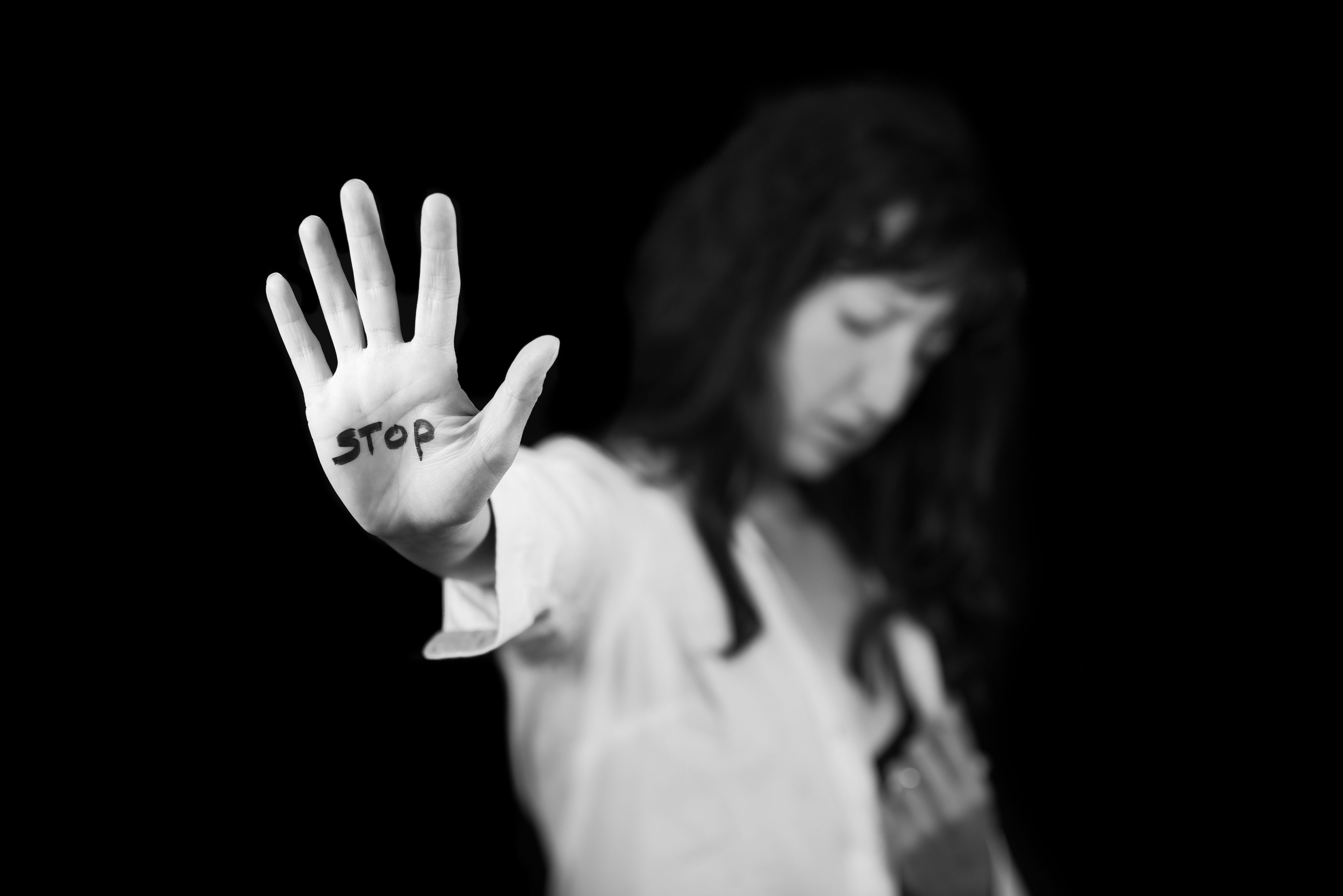 Stop violence against women. Hand saying stop
