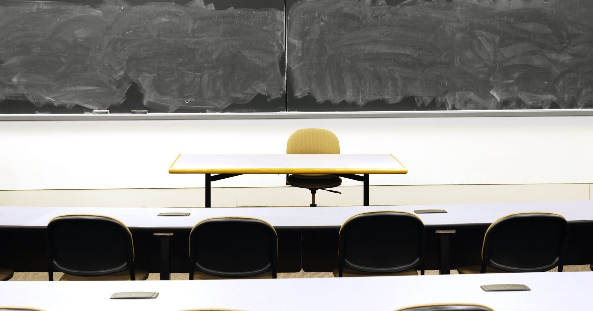 classroom with blackboard and desk