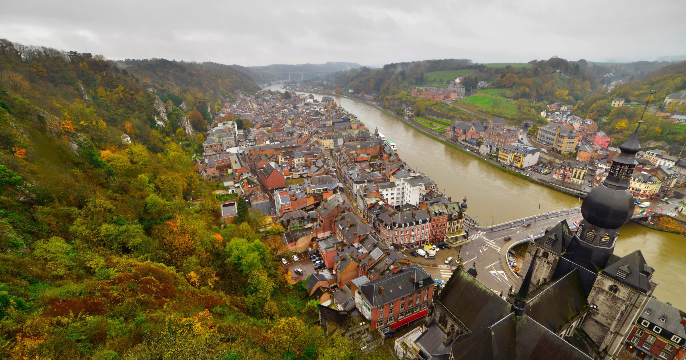 Top view of the city of Dinant with church on a cloudy day. Seen from the fortress. Belgium. Ardennes.