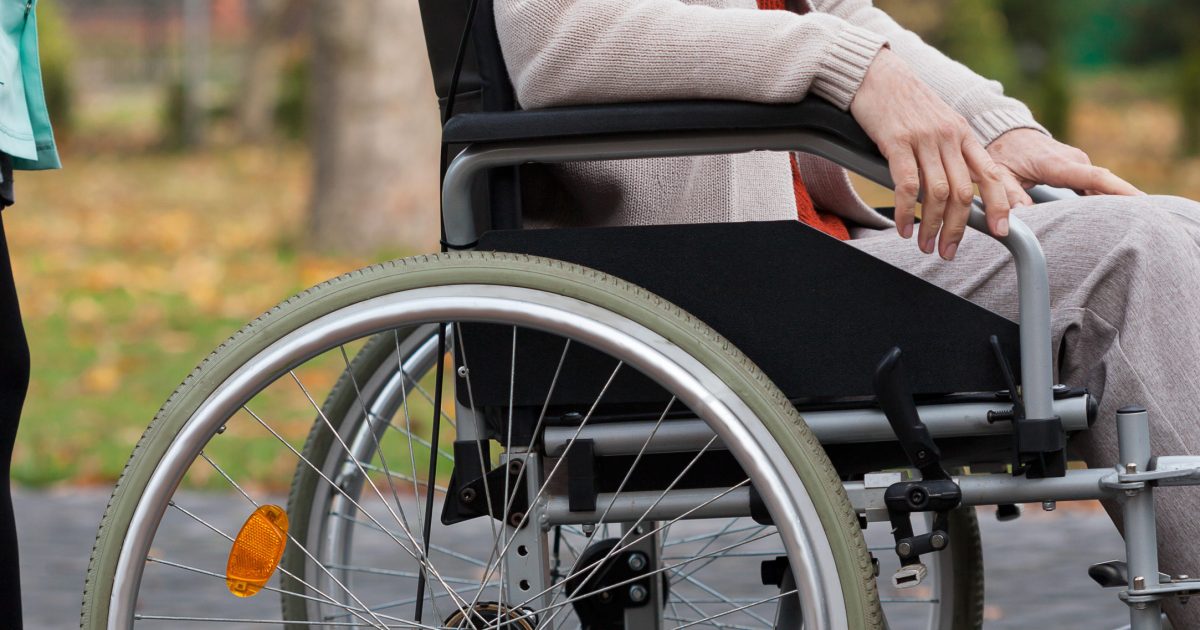 Lady on wheelchair in park