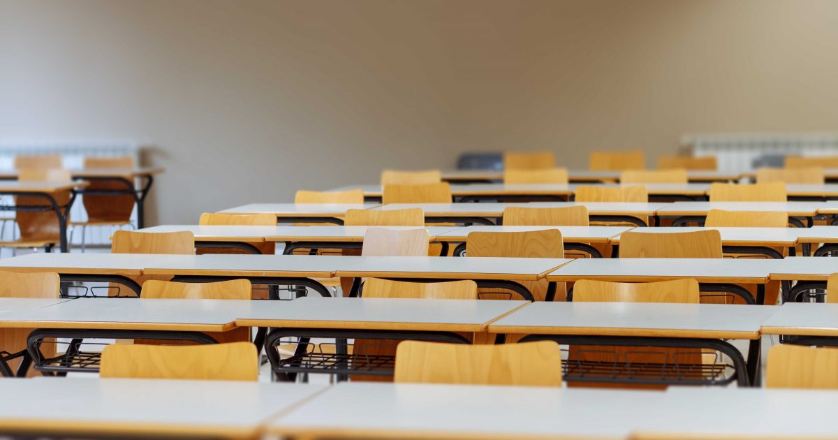 Desk and chairs in classroom