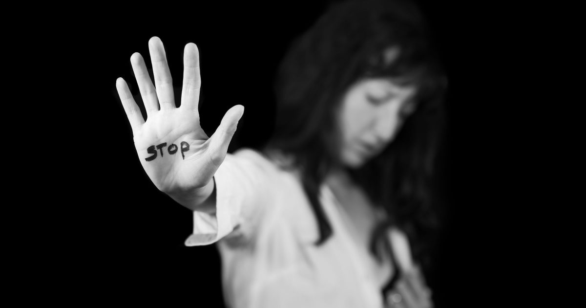 Stop violence against women. Hand saying stop