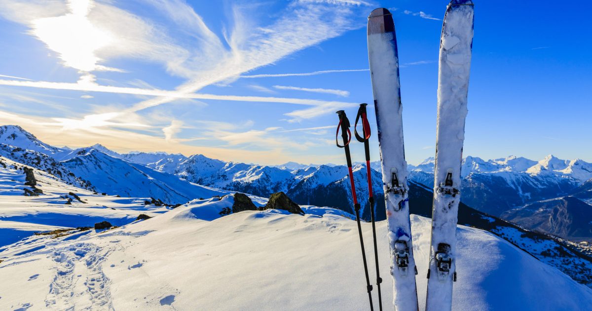Ski in winter season, mountains and ski touring equipments on th
