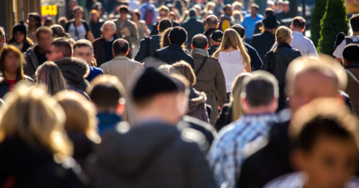 Anonymous crowd walking on a street in New York
